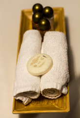 White towels, soap, shampoo in bathroom on hotel