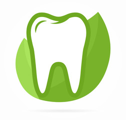 Logo combination of tooth on green leafs 