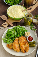 Schnitzel with mashed potatoes and salad