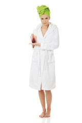 Beautiful woman with bottle of perfume.