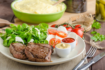 Beef steak with salad
