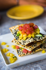 Appetizer with chips,tuna fish and fruits