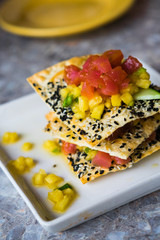 Appetizer with chips,tuna fish and fruits