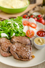 Beef steak with salad