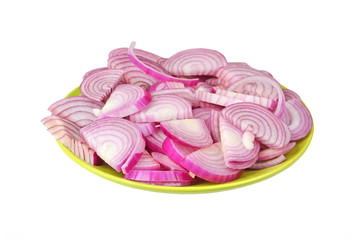 Slised red onion on plate, isolated on white background