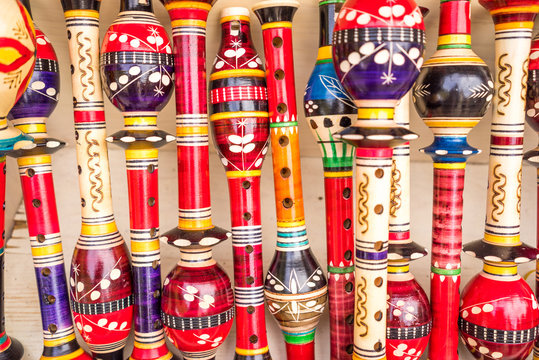 wooden colorful flutes at the street market in Montenegro. Useful for background.