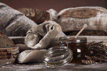 Fresh bread and wheat on the wooden