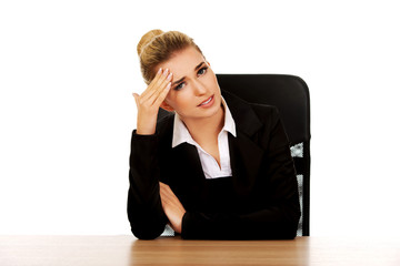 Beautiful businesswoman having huge headache