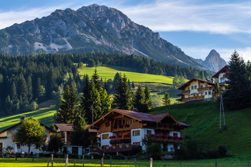 Fototapeta na wymiar Landscape of mountains, green field, sky, forest in Filzmoos, Salzburg, Austria