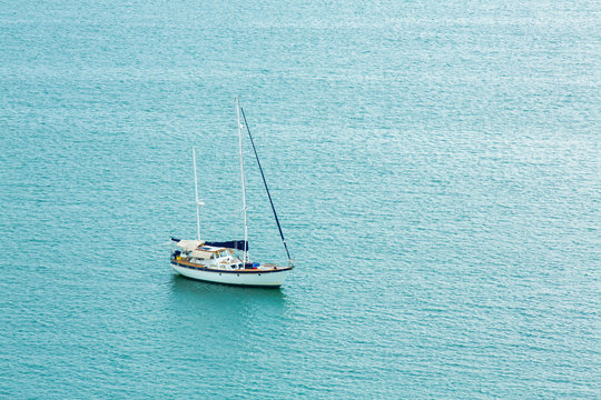 One alone boat in blue sea.