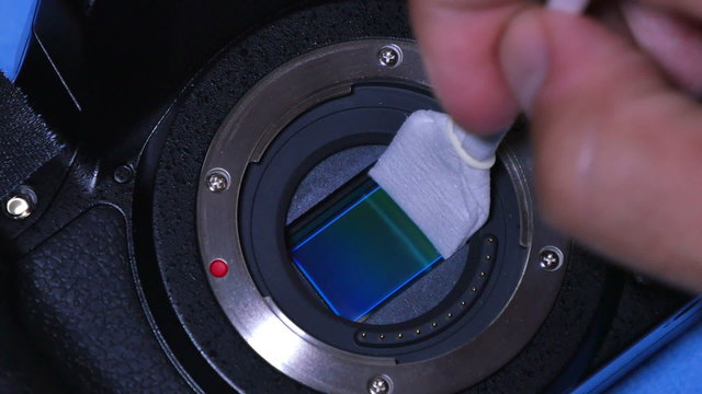 5065 Cleaning the sensor of a digital camera.	