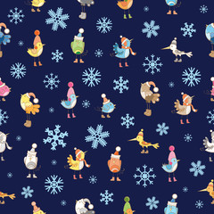Vector seamless winter pattern with cute cartoon birdies in knitted caps on a blue background.