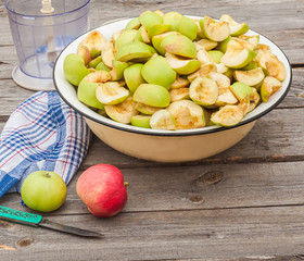 Sliced apple jam in a bowl next to the mixer