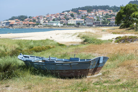 Fishing boat beached on the sand. Photo taken in Aldan, Cangas de Morrazo, Vigo estuary, Pontevedra, Spain