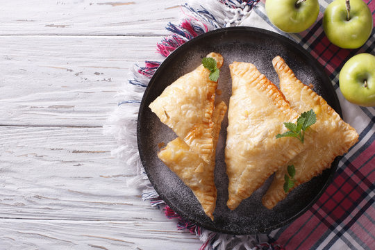 homemade apple pie turnover on a plate. horizontal top view


