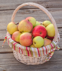 Rural autumn still life with a basket of apples