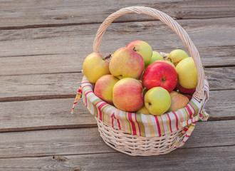 Rural autumn still life with a basket of apples
