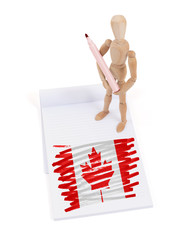 Wooden mannequin made a drawing - Canada