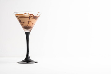 Chocolate martini on the wooden background
