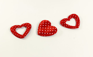 The red hearts on the white background.