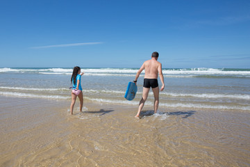 Father and daughter have fun on the beach