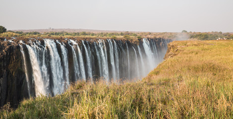 Panoramic view of Victoria Falls with toruists in Zimbabwe