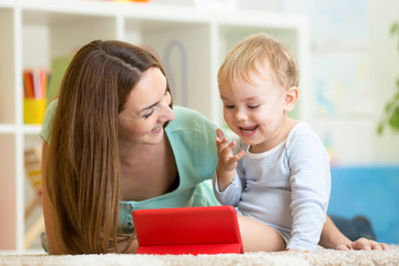 happy mother and her child with tablet pc