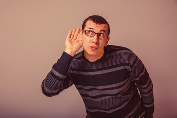 Fototapeta premium European-looking male of about thirty brunet put his hand to his
