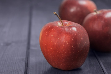 Red apples on a dark blue background