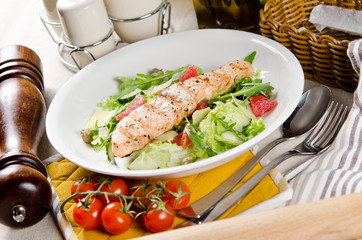 Salmon grilled with mixed salad of fresh fruits and vegetables