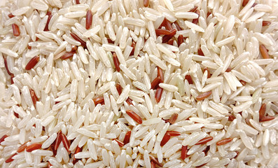 Food background of rice varieties : brown rice, mixed wild rice, white (jasmine) rice.
