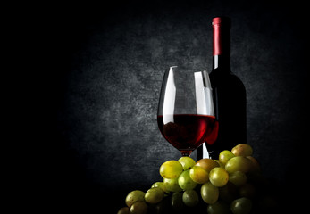 Wine with grape on black