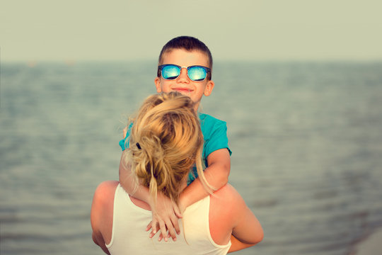 Mother With Son At Beach