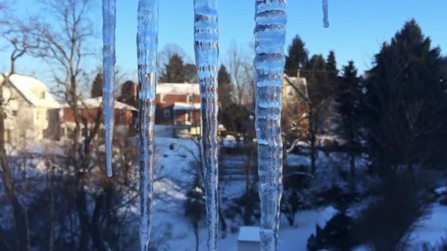 Cold Icicles Outside Home