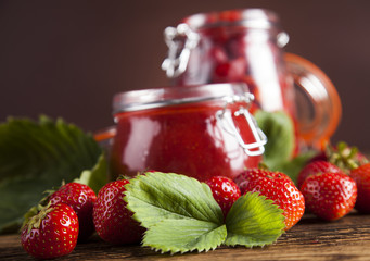 Set of glass jars with fruits jam 