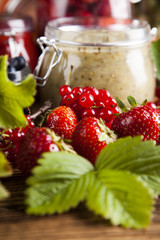 Set of glass jars with fruits jam 