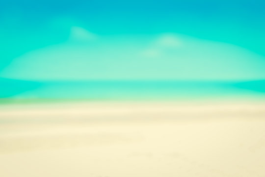 Blurred white sand beach and blue sky