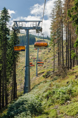 Rocky hill and chairlift landscape in summer