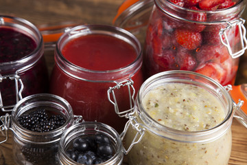 Set of glass jars with fruits jam 