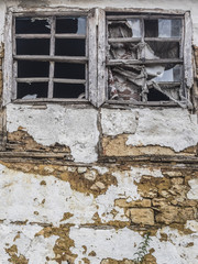 broken windows of an abandoned building