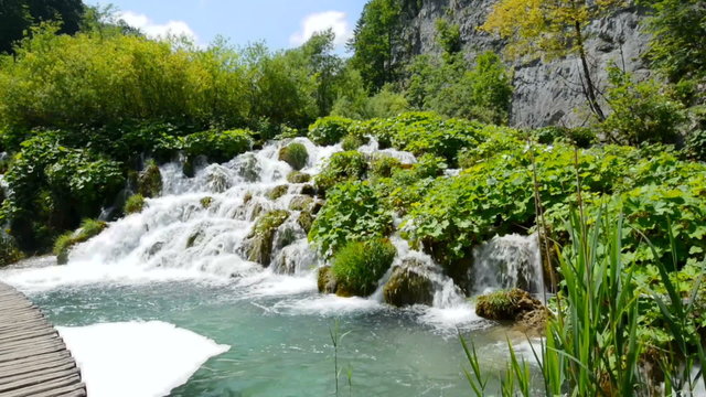 Wooden path by the waterfall