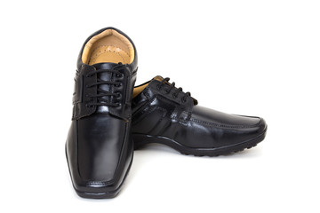 a pair of black leather shoes for men isolated on white available with clipping path