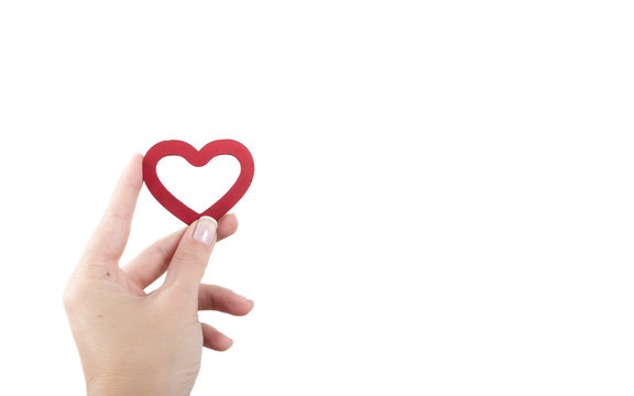 female hand holding heart isolated on white