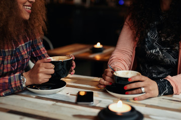 Friends drinking coffee at a cafe