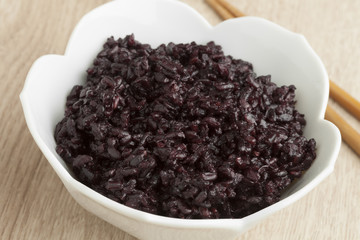 Bowl with black cooked rice