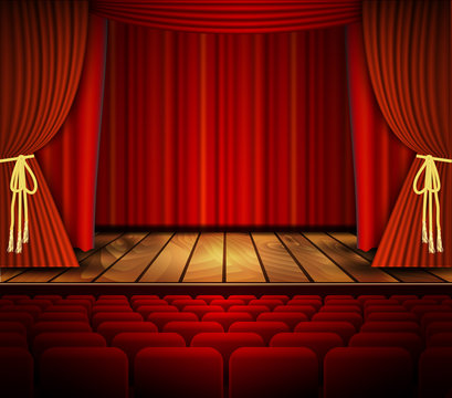 A theater stage with a red curtain