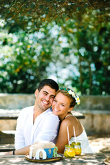 Beautiful young gorgeous happy wedding couple hugging and smiling in the park having picnic - 90830638