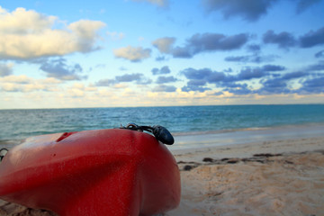 Kayak on sand of topical sea beach. Evening time. Nobody
