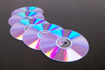 Dvd disks on black wooden table