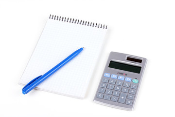 Calculator and paper notebook with blue pen